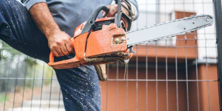 a timber worker using a chainsaw